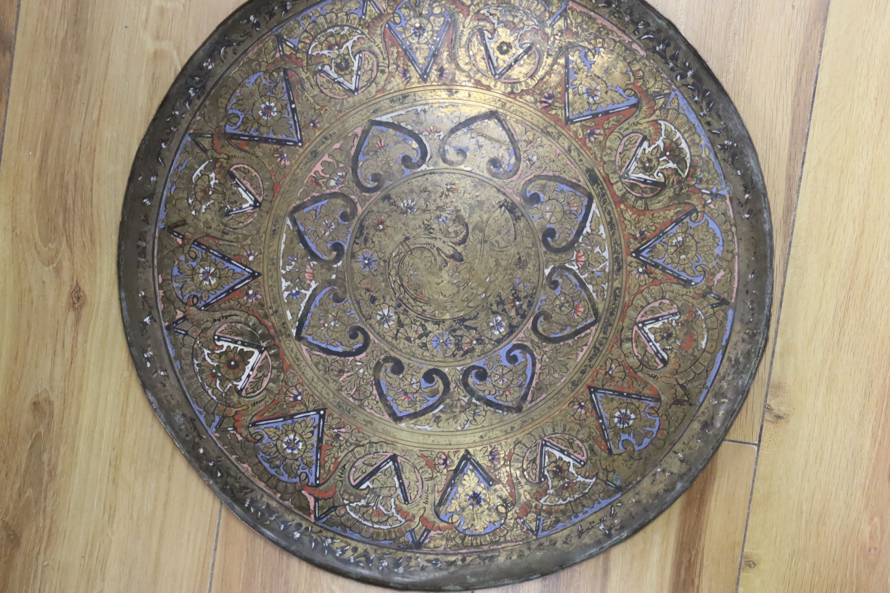 A pair of Islamic enamelled brass trays, diameter 38cm